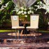 two black steel chairs beside table