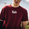 man in red crew-neck shirt under sunny sky