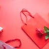 Red Paper Bag on Pink Table
