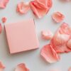 Gift in pink box with scattered petals around
