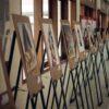 assorted paintings on white room