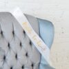 a blue chair with a white ribbon on it