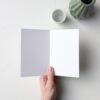 a hand holding a piece of paper