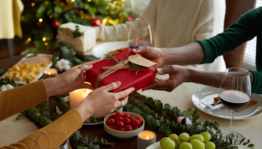 Friends Exchanging Christmas Gifts